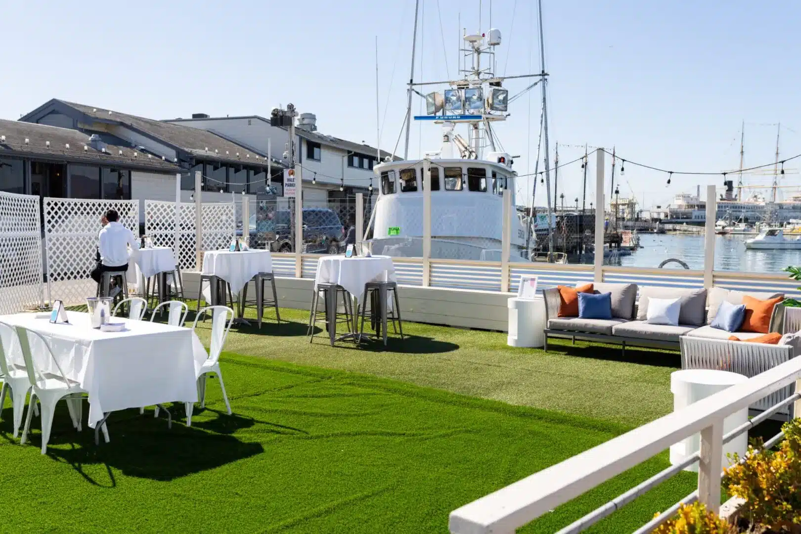 Scomas Bayside Patio with harbor in the background