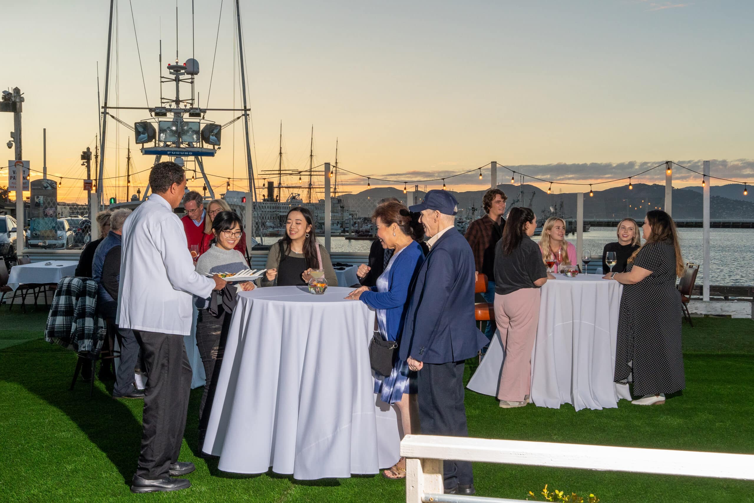 People enjoying the Bayside Patio at Scoma's Restaurant