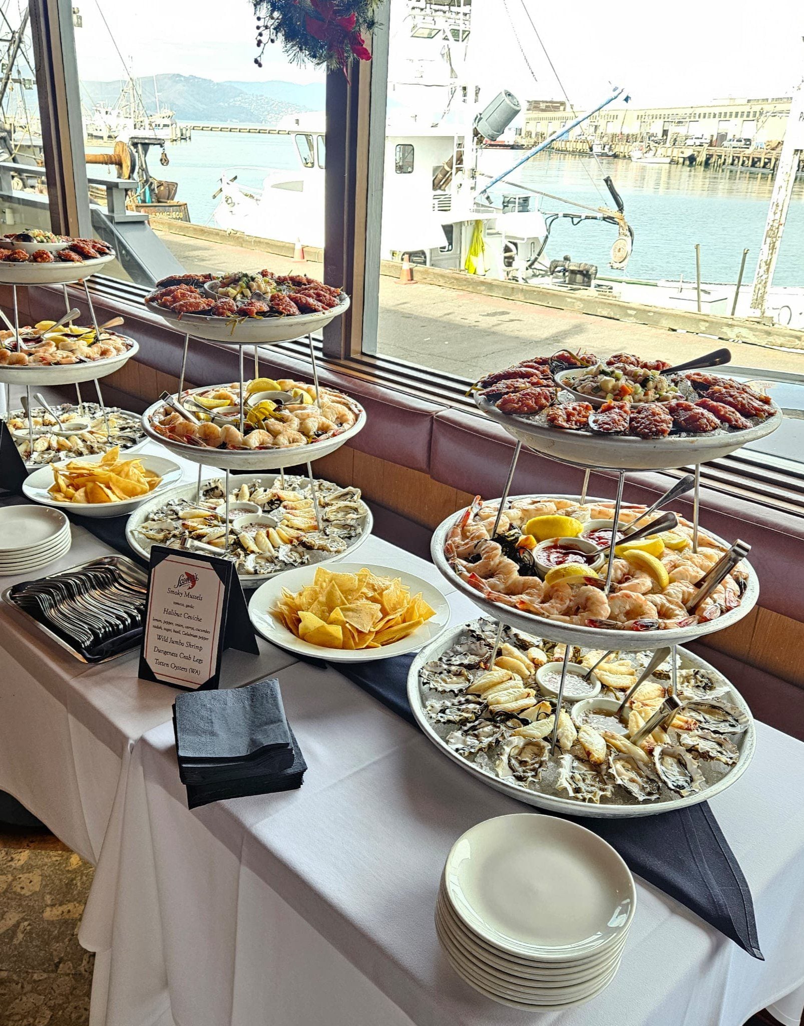 Scomas appetizer towers with the harbor in the background