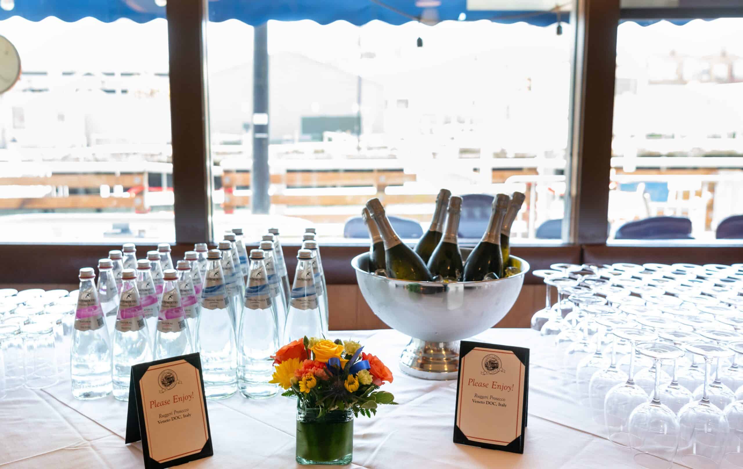 Scoma's 60th Anniversay table with water and Champagne and glasses