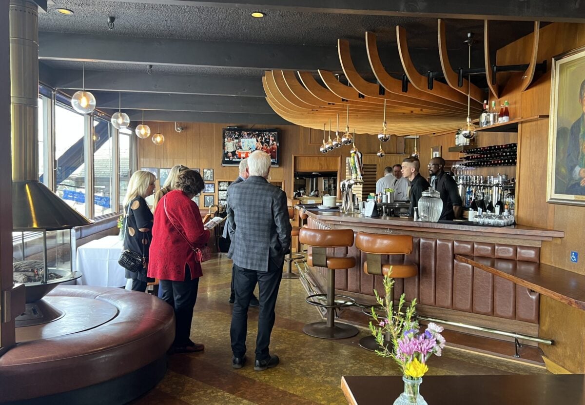 Scoma's upper bar with people and bartenders
